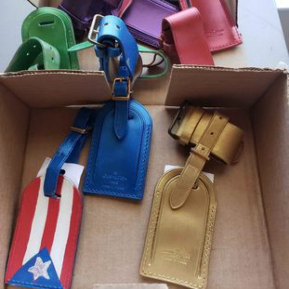 COPY - $40. EACH Louis Vuitton vintage colored luggage and travel tags.